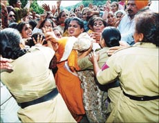 Members of the Punjab Aaganwadi Mulazam Union grapple with the police in an attempt to break a security cordon in Chandigarh on Thursday.