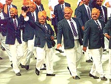 The Indian team waves to supporters.
