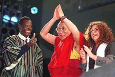 The Dalai Lama salutes the crowd