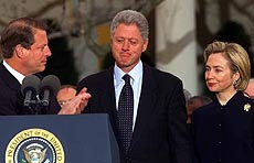 President Clinton get applause from Vice President Gore as first lady Hillary Rodham Clinton looks on outside the Oval Office 