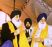 The SGPC chief, Mr G. S. Tohra, presents a siropa to the Punjab Chief Minister, Mr Parkash Singh Badal