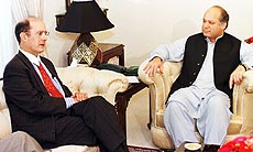 U.S. Deputy Secretary of State Strobe Talbott chats with Pakistani Prime Minister Nawaz Sharif before their meeting at the Prime Minister house in Islamabad on Wednesday. AP/PT
