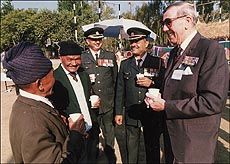 Lieut-Col Edward Gopsill and Havildar M. S. Thapa go down memory lane at a reunion of 1 Gorkha organised at Subathu, near Solan, on Thursday.