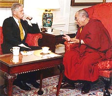 President Bill Clinton listens to Dalai Lama.
