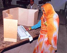 A voter exercises her franchise using an electronic voting machine in Delhi. Such machines were used in selected constituencies on Wednesday. 