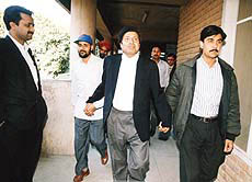 K. K. Jerath being taken away.