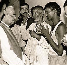 Prime Minister Atal Behari Vajpayee talking to flood victims during his visit to a relief camp at Gorkahpur on Thursday. —PTI