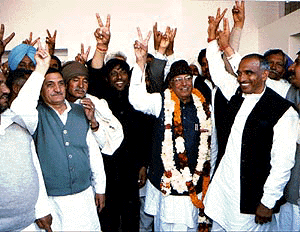 Mr Om Prakash Chautala is joined by other MLAs as they make the victory sign at Mr Chautala’s Chandigarh residence on Saturday. 