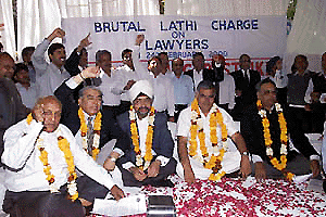 Members of the Bar Council and Bar Association of Delhi staging a protest in front of the Delhi High Court on Monday. 