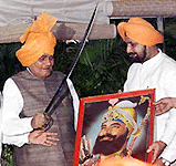 Prime Minister Atal Behari Vajpayee being honoured with a sword and a portriat of Guru Gobind Singh ji on Baisakhi in New Delhi on Thursday