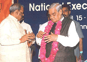 Prime Minister Atal Behari Vajpayee is greeted by UP  Chief Minister Ram Prakash Gupta at the Bharatiya Janata Party's National Executive meeting in New Delhi on Saturday
