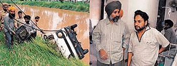 (Left) Police personnel and a few good Samaritans help in retrieving the ill-fated van from the canal; (right) Satnam Singh, who lost three family members during the accident, being consoled by a relative. — Photo by Rajesh Bhambi