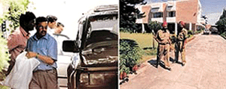 Income tax officials raid the house of Indian cricket coach Kapil Dev in New Delhi on Thursday.