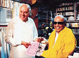 Jammu and Kashmir Chief Minister Farooq Abdullah presents a copy of the state autonomy resolution to Tamil Nadu Chief Minister M. Karunanidhi in Chennai