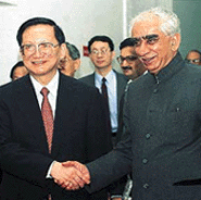 External Affairs Minister Jaswant Singh shakes hands with his Chinese counterpart, Mr Tang Jiaxuan, after their meeting in New Delhi on Saturday