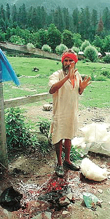 A sadhu describes the massacre to journalists near the blood-soaked spot at Pahalgam on Wednesday. 
