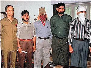Home Secretary Kamal Pande (left) with Hizbul Mujahideen commanders (from right) Saifullah Khalid, Masood, Riyaz Rasool and Farooq Mirchal after their meeting in Nehru Guest House, Srinagar, on Thursday.  Reuters photo