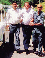 A.E. Pinto (centre), an accused in the Rs 133-crore urea scam, arrives at the CBI headquarters in New Delhi on Thursday.