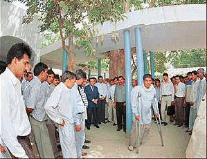 Justice is dispensed under a peepul tree during a Lok Adalat at Sonepat on Saturday.