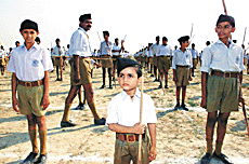 Five-year-old Rishab Vats, the youngest volunteer of the RSS, attends the three-day National Security Meet in Shastri Puram, near Agra, on Saturday.