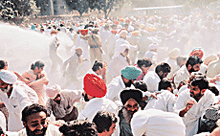 Agitating Punjab Congress activists are dispersed with water cannons at the housing board roundabout in Chandigarh on Tuesday.