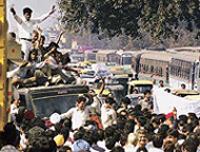 Demonstrators block a road in West New Delhi on Monday.