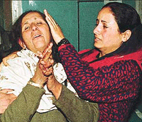 Relatives of Akeel Ahmed, who died in a landmine explosion, wail inside a hospital in Srinagar on Monday.