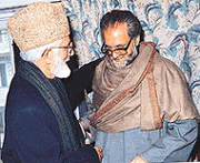 Hurriyat leaders Syed Ali Shah Geelani and Abdul Gani Lone shake hands shortly before the commencement of the Executive meeting of the party in Srinagar on Sunday. 