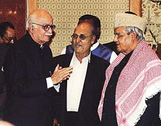 Prime Minister Atal Behari Vajpayee chats with Home Minister L.K. Advani.