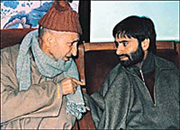 Abdul Ghani Bhat (left), Chairman of the All-Party Hurriyat Conference, talks with Mohammad Yaseen Malik, Chairman of the Jammu and Kashmir Liberation Front, meeting in Srinagar on Tuesday.