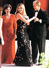 U.S. President George W. Bush dances with his daughter Jenna while the First Lady Laura Bush laughs at the Florida inaugural ball held in Washington, DC, on Saturday night. 