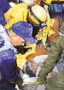 Russian rescue workers bring out Ummerben, an elderly woman who survived for over 100 hours in Bhachau, 70 km from Bhuj, on Tuesday.