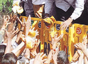 People raise their hands for food from a relief truck on the outskirts of Bhuj on Wednesday.
