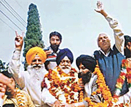 SAD candidate Raj Mohinder Singh Majitha is taken in a victory procession in Majitha on Friday.
