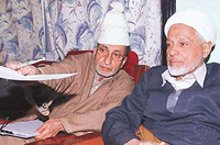 Chairman of the All-Party Hurriyat Conference (APHC) Abdul Gani Bhat with executive member Moulvi Abbas Ansari (right) during a meeting at their headquarters in Srinagar on Monday.  Reuters photo