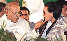 Congress President Sonia Gandhi and former party President P.V. Narasimha Rao discuss a point at the 81st plenary session of the Indian National Congress at Rajiv Gandhi Nagar in Bangalore on Saturday.