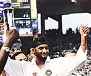 The punjab lad did it for India: Harbhajan Singh, who with a haul of 32 wickets in three Tests broke the back of Australia, holds his Man-of-the-Series trophy at the conclusion of the third Test at Chennai on Thursday.