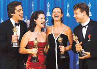 Benicio Del Toro, Marcia Gay Harden, Julia Roberts and Russell Crowe share a laugh with their Oscars after the 73rd annual Academy Awards at Shrine Auditorium in Los Angeles, California, on Monday. 