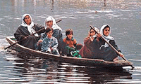 A group of women along with their children heading for a medical camp organised by the BSF near Dal Lake in Srinagar on Saturday.