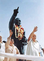 Mr Kanshi Ram and Ms Mayawati waves to the crowd in front of the statue of Dr B.R. Ambedkar in Ludhiana on Saturday. 