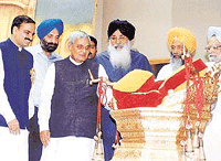 Prime Minister A.B. Vajpayee, Union Tourism Minister Ananth Kumar, Punjab Chief Minister Parkash Singh Badal, Union Chemicals and Fertiliser Minister Sukhdev Singh Dhindsa and former Union Finance Minister Manmohan Singh, look at the replica of the Throne of Maharaja Ranjit Singh at the Bicentennial Coronation Celebrations in New Delhi on Saturday.