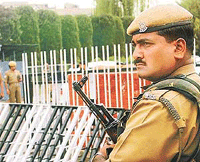 A CRPF jawan keeps guard near the Civil Secretariat in Srinagar on Tuesday as security is beefed-up with the opening of the Darbar on May 8. 
