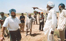 A farmer of Mauli Baidwan village protests against the demarcation exercise being conducted by officials of PUDA on Thursday.