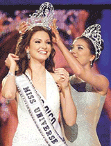 Miss Puerto Rico, Denise Quinones, is crowned Miss Universe 2001 by Miss Universe 2000 Lara Dutta at the 50th Miss Universe pageant in Bayamon, Puerto Rico, on Friday.