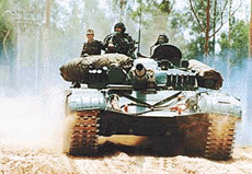 Soldiers drive a T-72 tank during a drill at Kala Chingra village in Punjab on Thursday. 