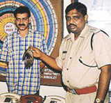 Mr Ganesh Gupta, ACP, Delhi police, with Dr Nagender Gupta who was arrested in New Delhi on Friday for creating panic.