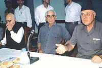 Jammu and Kashmir Chief Minister Farooq Abdullah (right) with Union Defence Minister Jaswant Singh (centre) and Union Home Minister L. K. Advani during a meeting in Srinagar on Saturday.