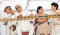Mr Bhupinder Hooda, president, HPCC (extreme left), discusses a point with former Union Minister Natwar Singh during the lalkar rally at Panipat on Sunday. Mrs Mohsina Kidwai and Ms Selja are also seen.