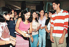 Channel V VJs, Peeya and Gaurav, sign autographs for their fans.