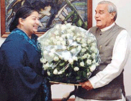 Tamil Nadu Chief Minister Jayalalitha presents a bouquet to Prime Minister Atal Behari Vajpayee in New Delhi on Tuesday.